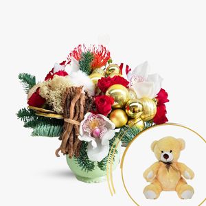 Arrangement of Christmas flowers and teddy bear