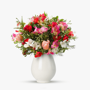 Bouquet of freesias, tulips and wax flower