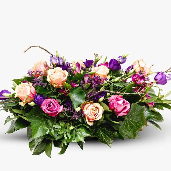 Funeral arrangement with roses and eustoma