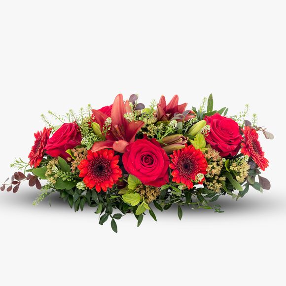 Funeral arrangement in shades of red