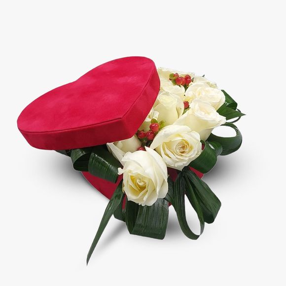 Heart arrangement with white roses and aspidistra