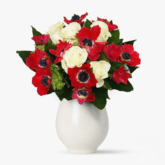 Bouquet of red anemones and white roses