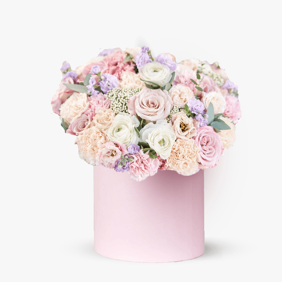 Arrangement in a box with carnations and ranunculus