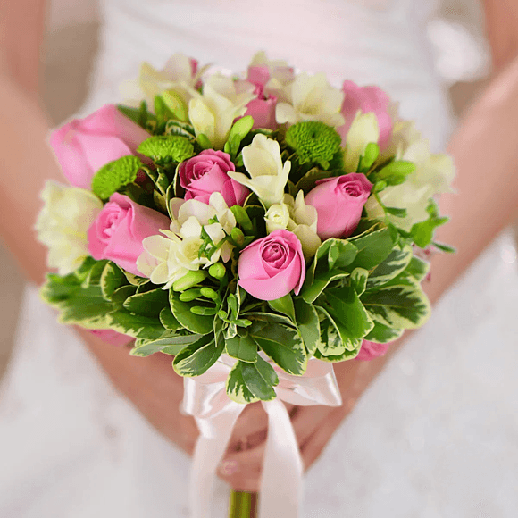 Bridal bouquet with roses and freesias