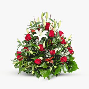 Funeral arrangement with lilies and roses