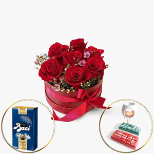 Box with red roses, candies and aroma burner