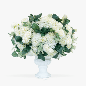 Wedding table arrangement in white and green tones