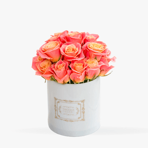Wedding table arrangement with orange roses