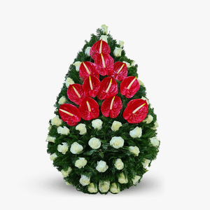 Funeral wreath made of fir, with white roses and red anthurium