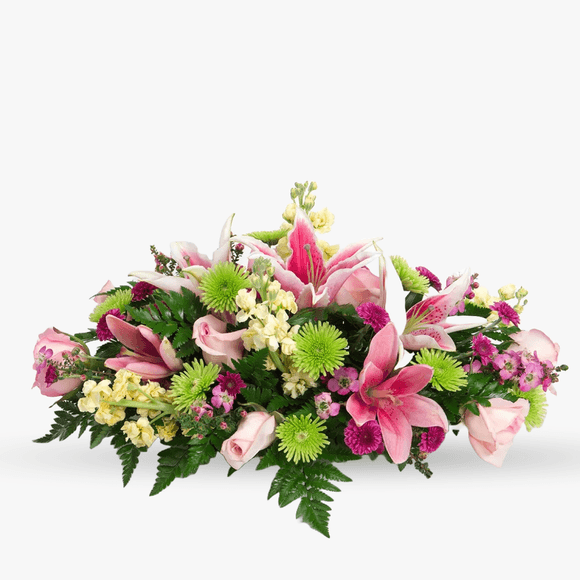 Funeral arrangement with lilies